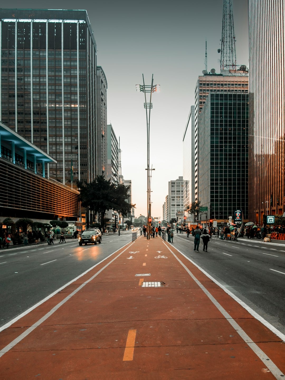 a city street lined with tall buildings and tall skyscrapers
